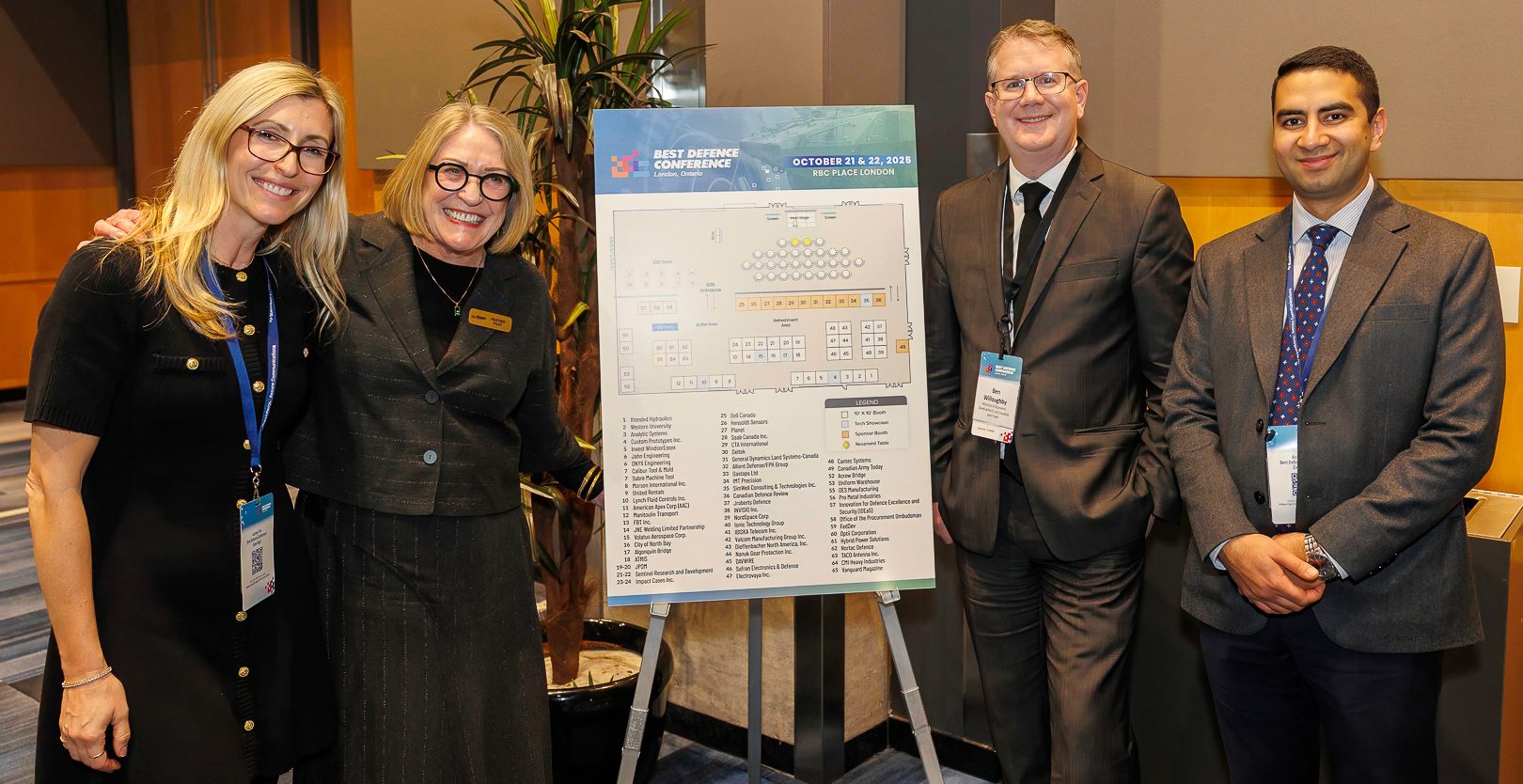 Delegates reviewing the exhibit floor plan at Best Defence Conference